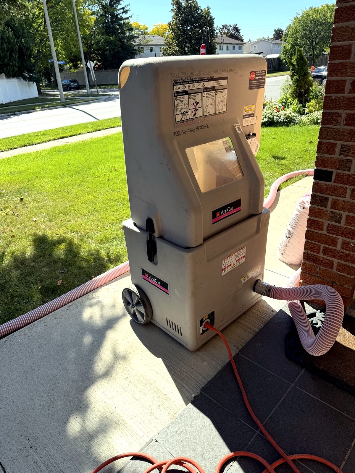 AttiCat insulation blower with 'only pink insulation' written on it
