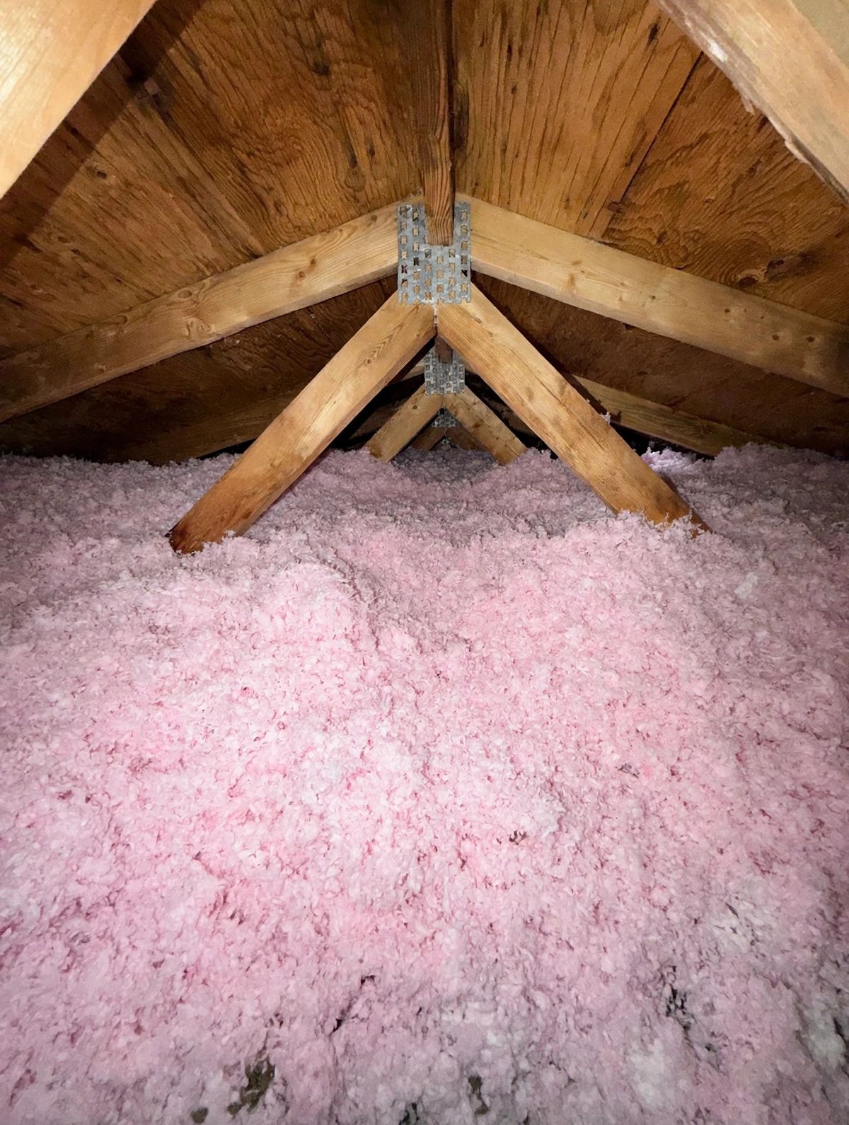 Pink insulation blown up to the roof peak
